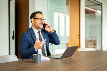 Business professional communicating on a mobile phone, discussing legal matters and accounting with...