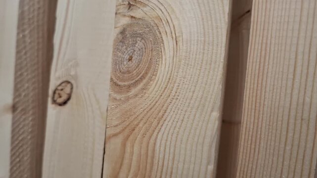 Natural wood boards with visible grain in close view. Timber texture, building material, rustic surface, carpentry detail, construction concept.