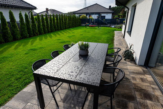 Garden table with water drops after rain