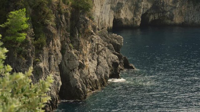Sheer Limestone Cliffs and Sea Cave Along the Amalfi Coast