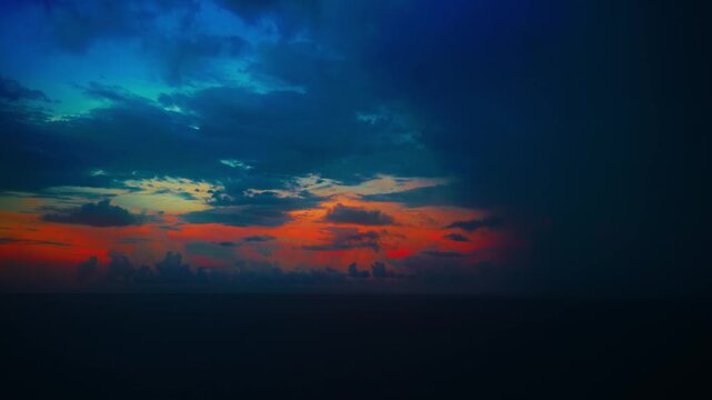 Dramatic Sunset Seascape with Heavy Storm Clouds Over Ocean Horizon Copy Space
