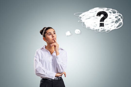 Thoughtful businesswoman considering a question mark in a speech bubble, exploring answers, research, curiosity, and problem solving at work.