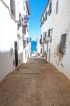 Altea old town street leading to Mediterranean Sea