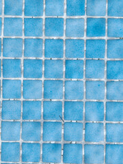 Blue square tiles creating a mosaic pattern surface