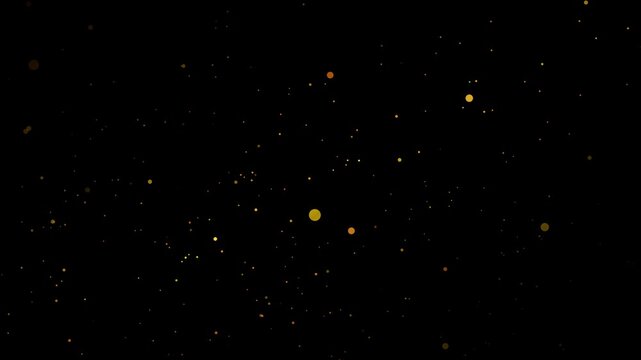Golden glitter particles sparkling and floating on dark background for luxurious overlay effect
