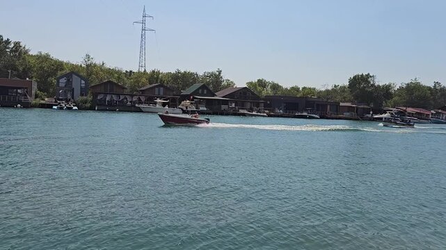 bridge over buna river and a motor boat in ulcinj montenegro with houses and boats video