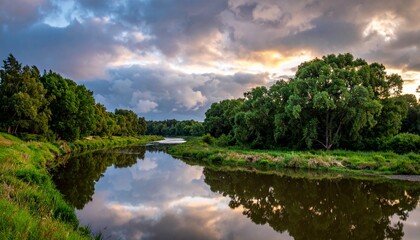 Obraz premium Quiet River Mirroring Dramatic Clouds at Sunset Landscape