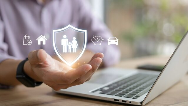 Hand holding digital family insurance shield icon for home, car and financial protection plan