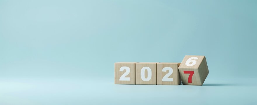 Wooden blocks changing from 2026 to 2027 for new year celebration and business planning