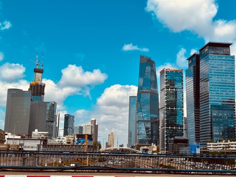 TEL AVIV, ISRAEL - SEPTEMBER 4, 2026: Modern urban skyline and high-rise commercial office skyscrapers in the Tel Aviv metropolitan area, featuring contemporary glass facades and construction cranes 