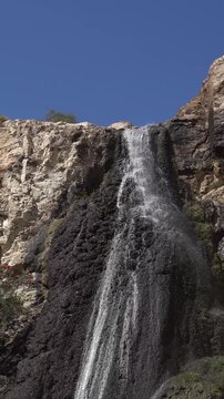 Desert Waterfall Flowing Down Rocky Cliff in Israel