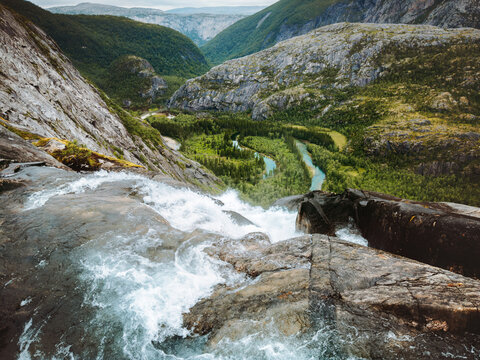 Rago national park landscape in Norway with Litlverivassforsen waterfall, winding river and green forest mountain valley aerial view Scandinavian wilderness nature travel outdoors remote destination
