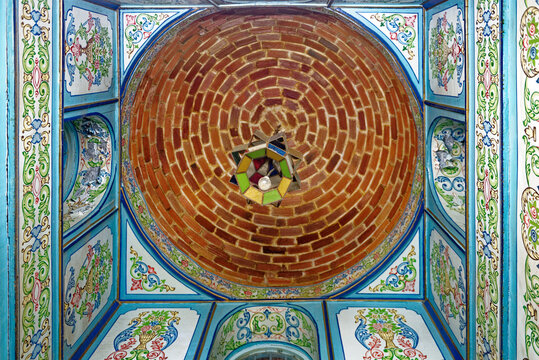 Ornate Ceiling with Concentric Brick Dome and Painted Floral Panels