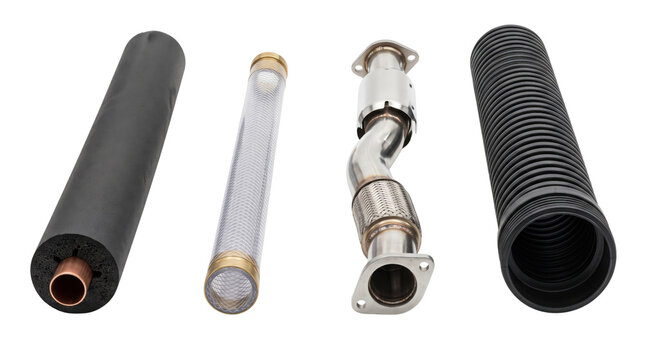 Industrial exhaust system components, stainless steel muffler pipe and flexible automotive tubes, mechanical engine parts on white background
