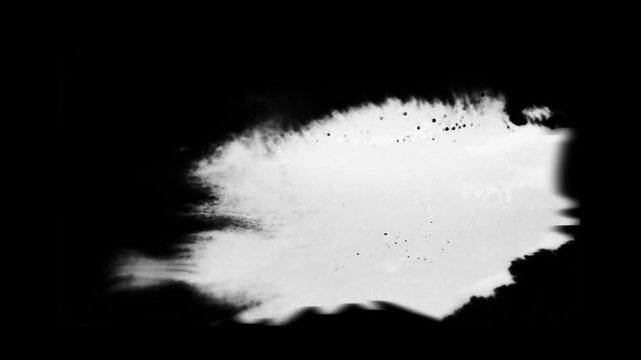 White Ink Blots Blooming and Expanding on Black Background Footage