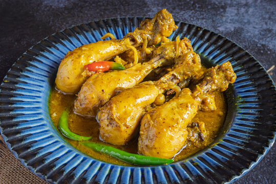 Aam Kasundi Murgi Bengali Chicken Curry with Raw Mango and Mustard Sauce Traditional Indian Style Chicken Dish Served in a Bowl