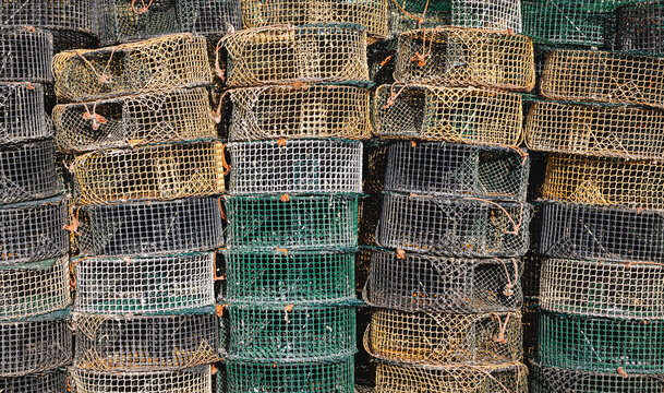 Stacked fishing traps ready for coastal fishing in Goro