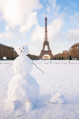 Snowman enjoying winter sun on champ de mars with eiffel tower © Kristof