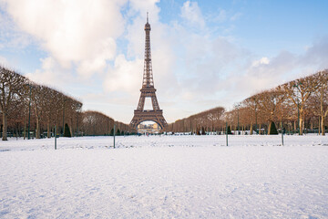 Eiffel tower in winter with snow covering champ de mars © Kristof