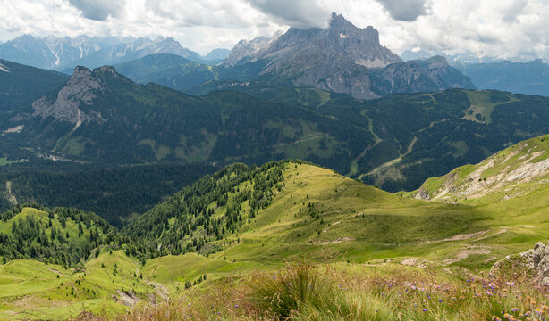 Selva di Cadore, Italy. Alpine panorama across the Mondeval area with rugged Dolomite peaks, forests and mountain trails