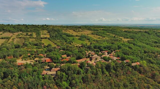 Aerial around view of old rustic vintage houses with wine cellars in Rogljevacke pivnice in Negotin region of Serbia, 4k