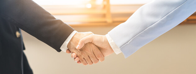 Successful deal asian young business woman, partnership, teamwork handshake or greeting together at office after project done, good deal. Happy business people, group meeting, colleagues shaking hands © KMPZZZ