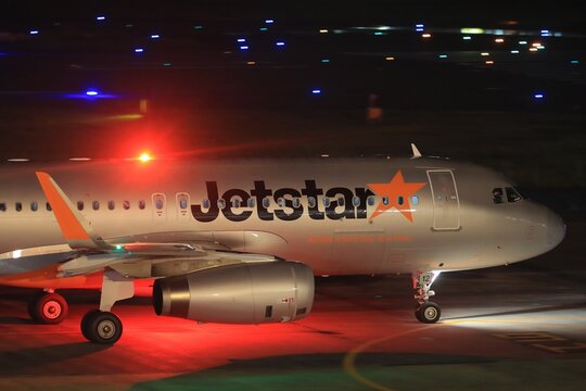 A Jetstar Japan Airbus A320 on the ground at night on October 5, 2016 in Japan.