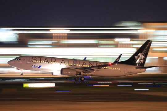 An All Nippon Airways (ANA) aircraft in Star Alliance livery, panned at night at Fukuoka on October 24, 2016 in Japan.