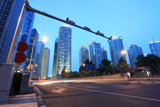 The highway car light trails of modern city buildings