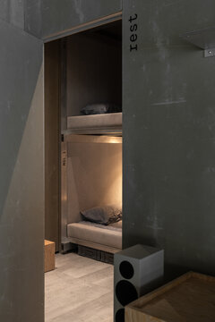 Compact Sleeping Pods Inside Aviation Hangar Office