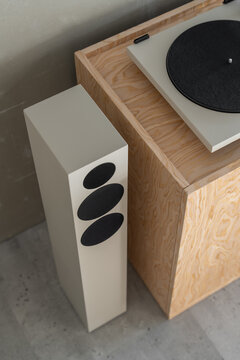 Close Up of Vinyl Turntable and Speaker in Industrial Office