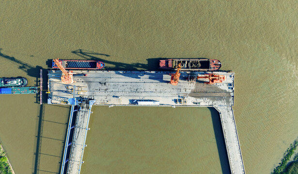 cargo port with cranes loading container ships