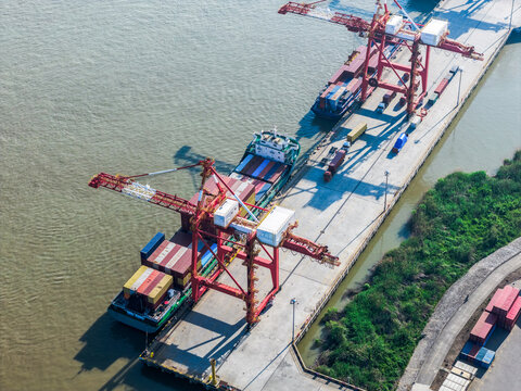 cargo port with cranes loading container ships