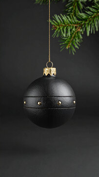 Black Leather Punk Christmas Bauble with Metal Studs on Dark