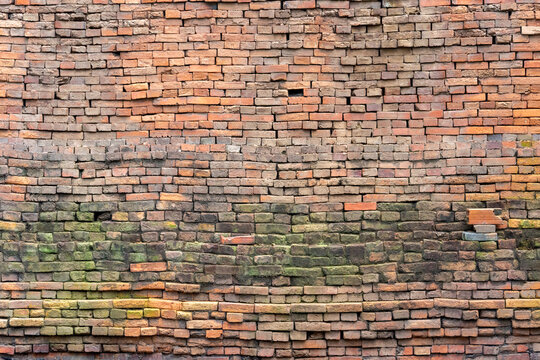 Texture de mur de briques brun rouge