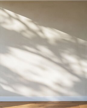 Caramel brown plaster wall with soft cat shadows, a sanded texture and warm window light for a home interior mockup with copy space