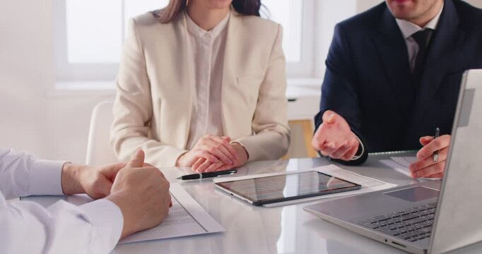 Business people work with tablet pc in office, shaking hands to celebrate agreement and partnership, focusing on collaboration and deal success in a professional setting with engagement.