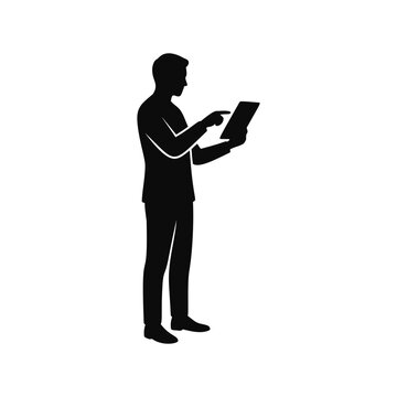 Silhouette of a businessman standing and interacting with a digital tablet