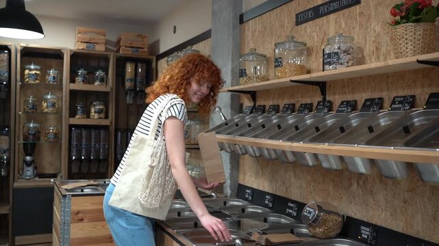 Young woman buying food at a zero waste shop