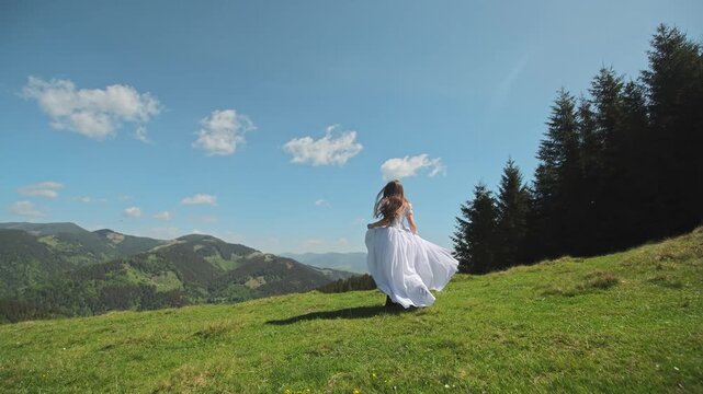 Bride runs across an open mountain meadow in a flowing white wedding gown, Wide countryside view expresses freedom romance and scenic destination travel