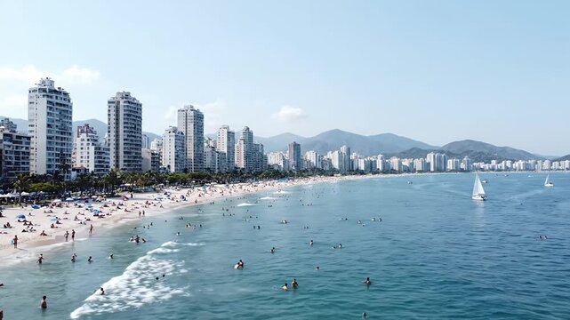 Sunny beach shoreline with modern city skyline.