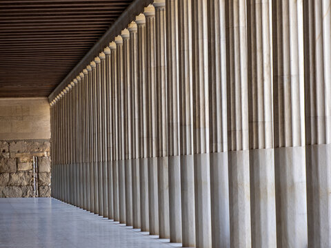 Row of ancient Greek columns forming a covered colonnade