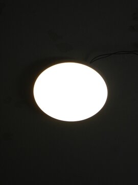 round led light on the ceiling in the dark