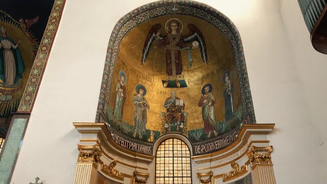 Beautiful interior views of the historic Salerno Cathedral showing its majestic white vaulted nave, religious Byzantine gold mosaics, ancient frescoes, and ornate altars in Campania region,