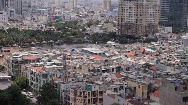 Ho Chi Minh City Metro Train Crossing Elevated Railway Above Dense Urban Neighborhood
