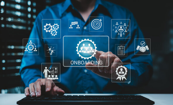 Onboarding New Employee Process Concept. Businessman typing on keyboard with icons representing onboarding process, human resources, training, employee integration, hiring, and corporate orientation.