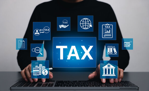 Tax Concept. Businessman using laptop for online tax planning and financial analysis with taxes icons, finance data, taxation form and IRS-related information for income reporting and calculation.