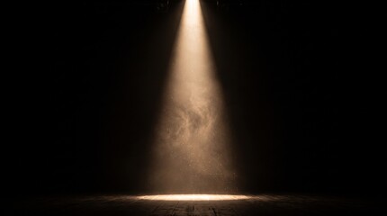 Fototapeta premium Bright theatrical spotlight shining from above with warm glowing light beam and smoky haze on a dark stage background