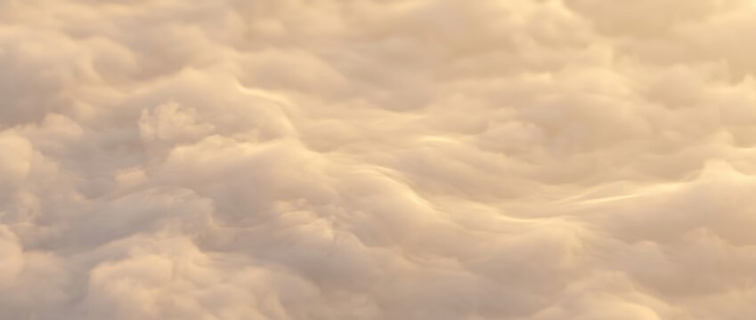 Aerial view of dense, fluffy clouds illuminated by warm golden sunlight, creating a soft, textured, and undulating blanket of vapor across the sky at sunset or sunrise