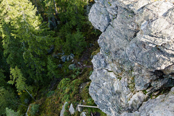 View from a stone rock in the forest. Mineral in the Giant Mountains in the Czech Republic. Geology and vegetation in the Krkonoše area in Europe. © Felix Geringswald